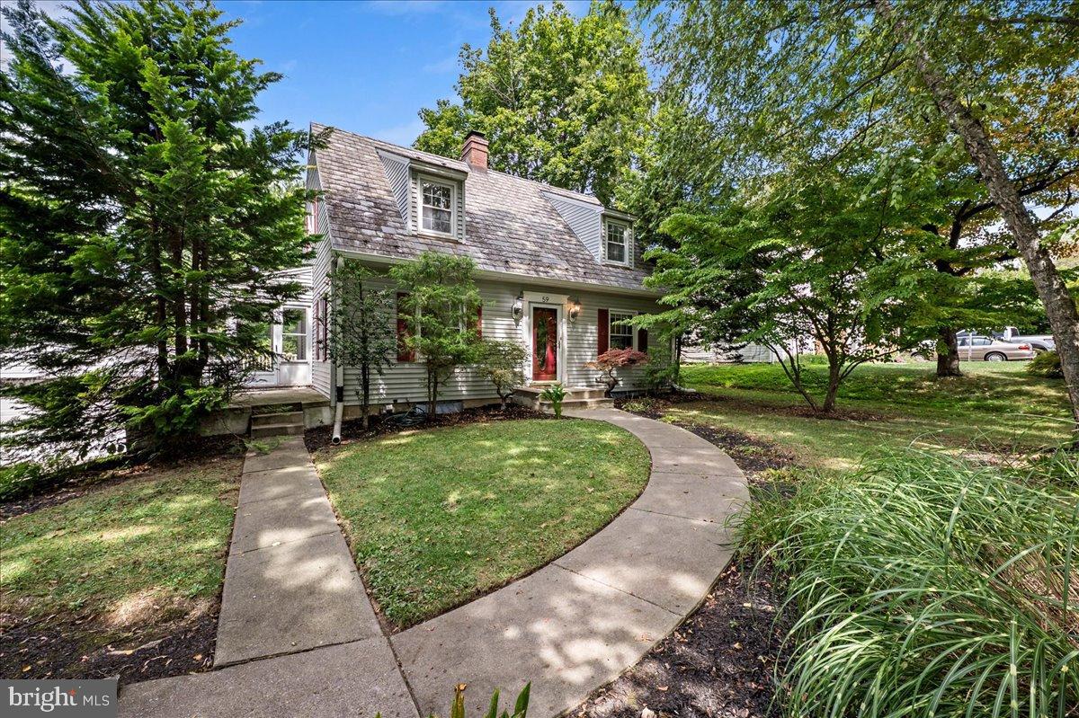 59 West Macada Road Bethlehem, PA 18017 - Photo 2 of 31 Charming home nestled in lush greenery.