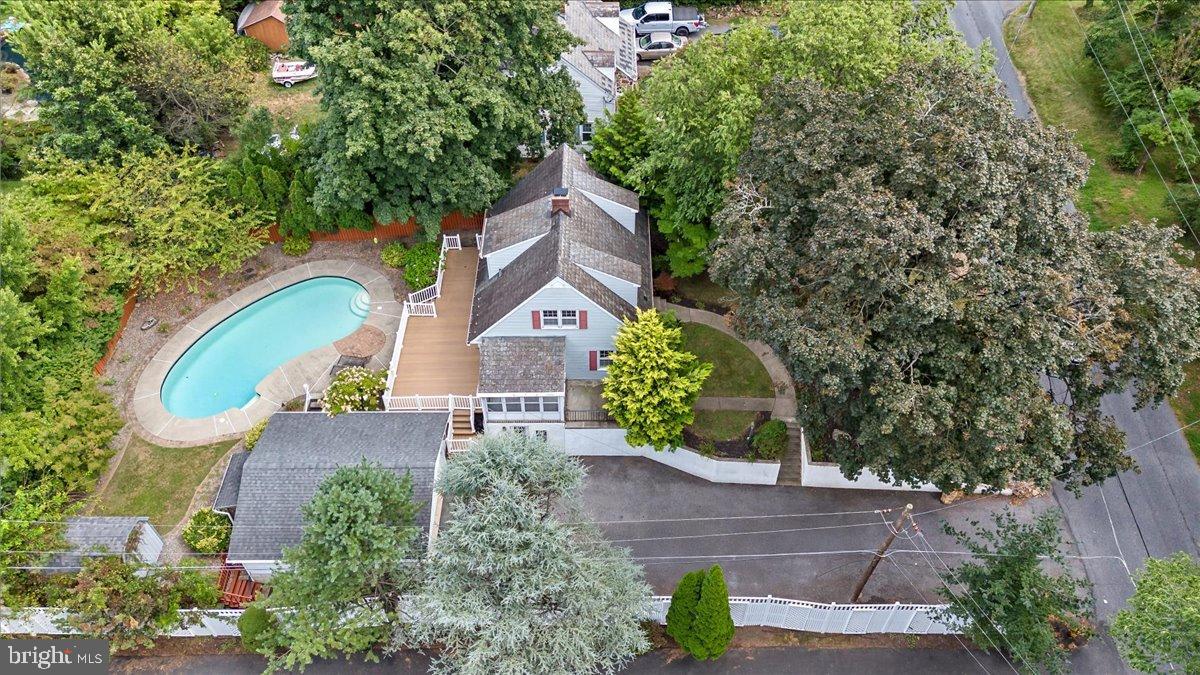 59 West Macada Road Bethlehem, PA 18017 - Photo 6 of 31 Charming home with pool and lush greenery.
