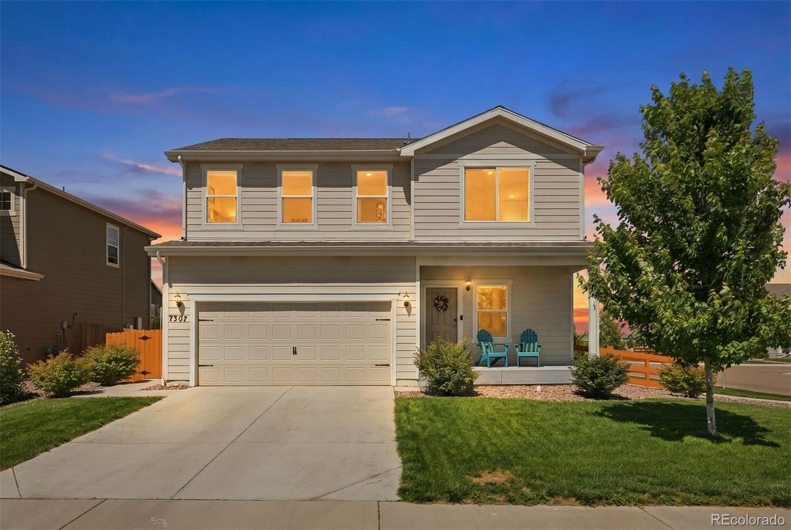 7307 Animas Avenue Frederick, CO 80530 - Photo 7 of 49 a front view of a house with garden