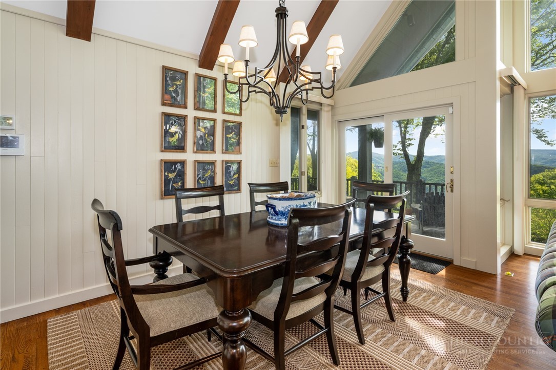 246 Mulberry Lane Boone, NC 28607 - Photo 8 of 49 a view of a dining room with furniture window and wooden floor