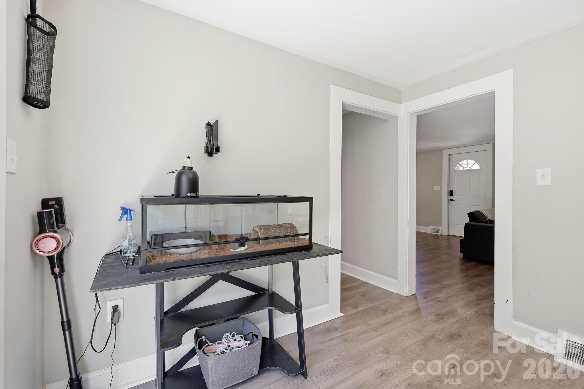 197 Mulberry Street Clyde, NC 28721 - Photo 22 of 31 a view of a workspace with furniture and a bathroom