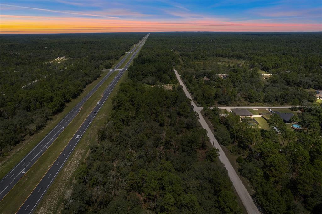 18172 Commercial Way Weeki Wachee, FL 34614 - Photo 3 of 12 a view of city and green space
