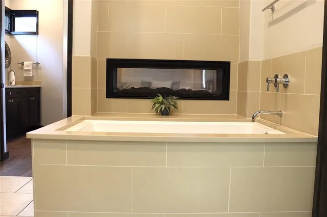a bathroom with a sink and mirror
