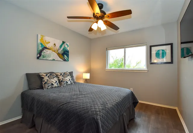 a spacious bathroom with a double vanity sink and a mirror