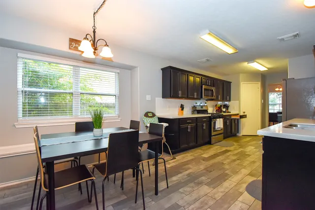a view of a dining room with furniture window and outside view