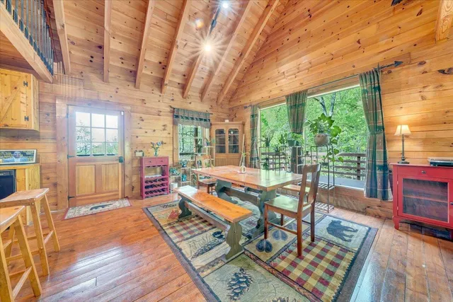 a outdoor space with lots of furniture and wooden floor