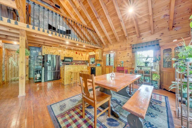 a view of a kitchen with wooden floor