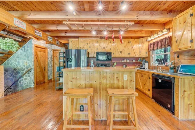 a view of a swimming pool with a patio and couches chairs