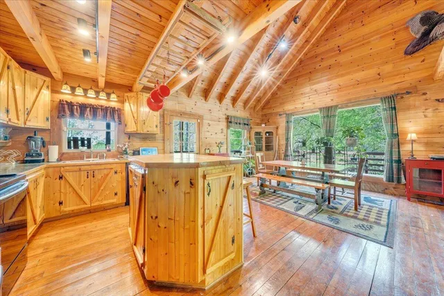a kitchen with stainless steel appliances granite countertop a stove and a sink