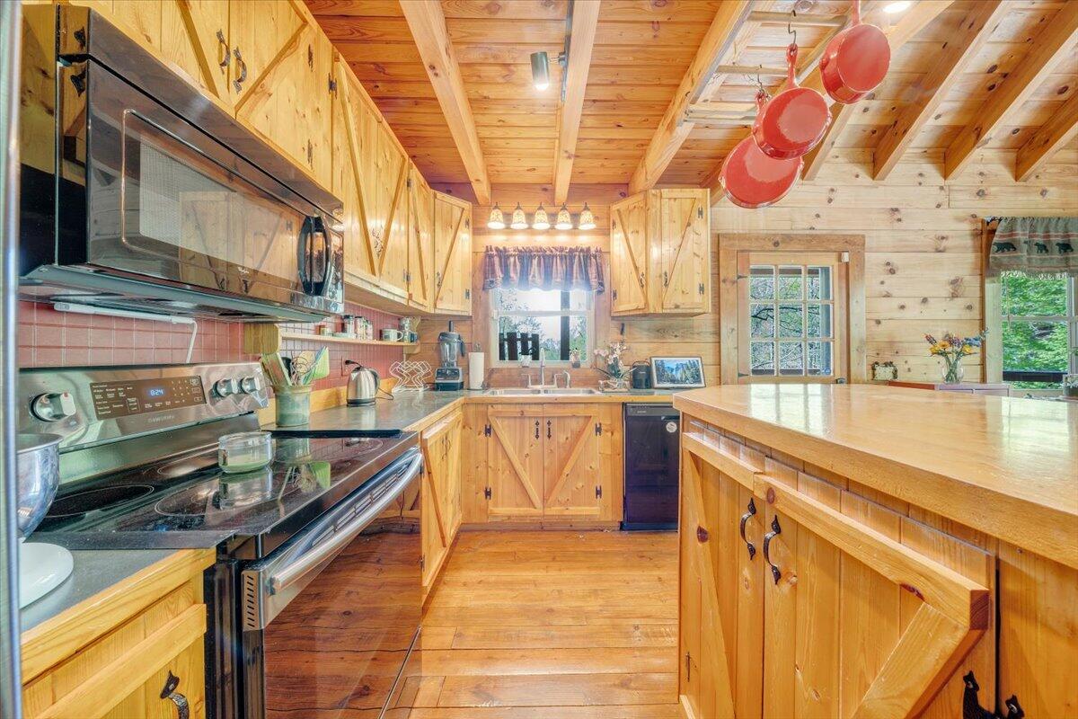 13357 Callaway Road Callaway, VA 24067 - Photo 18 of 62 a kitchen with stainless steel appliances granite countertop a stove and a sink