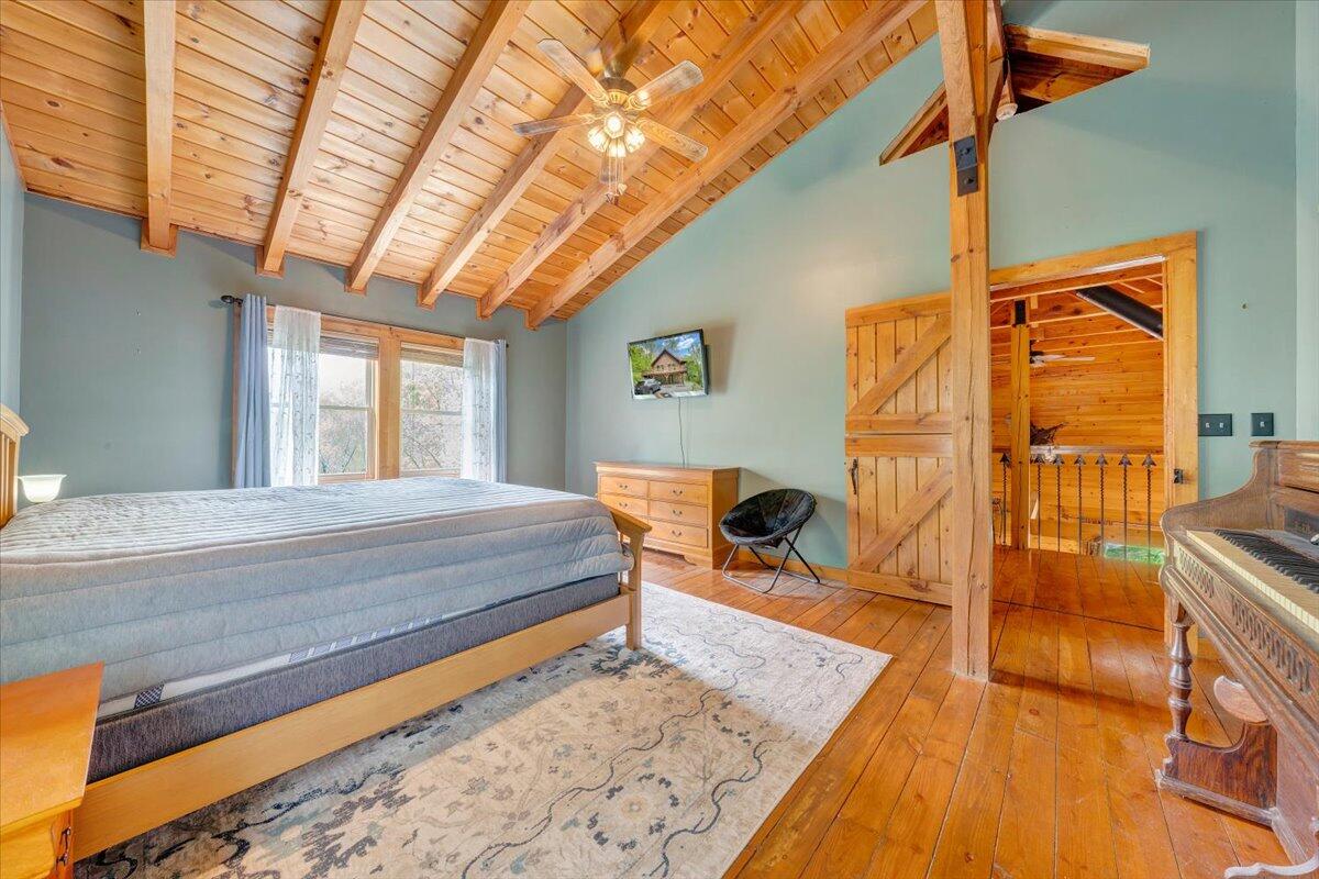 13357 Callaway Road Callaway, VA 24067 - Photo 27 of 62 a bed room with a bed and glass door