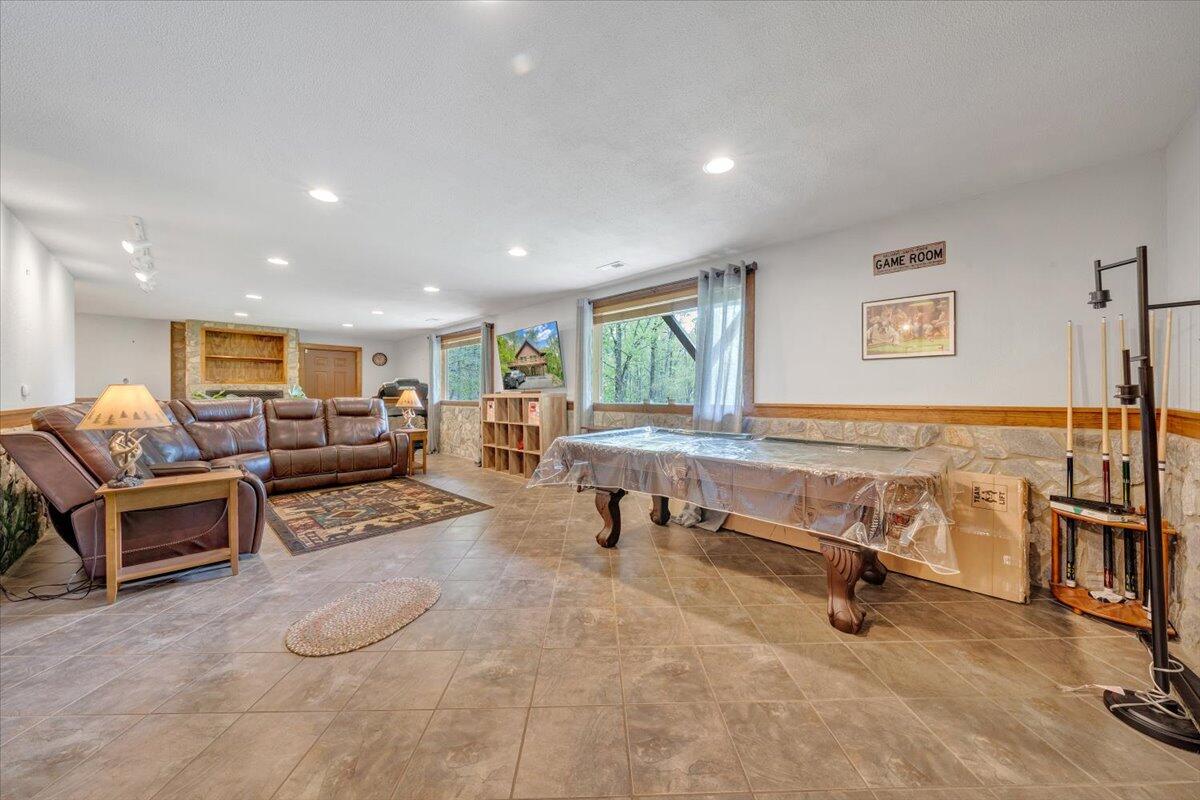 13357 Callaway Road Callaway, VA 24067 - Photo 33 of 62 a living room with furniture gym equipment and a window