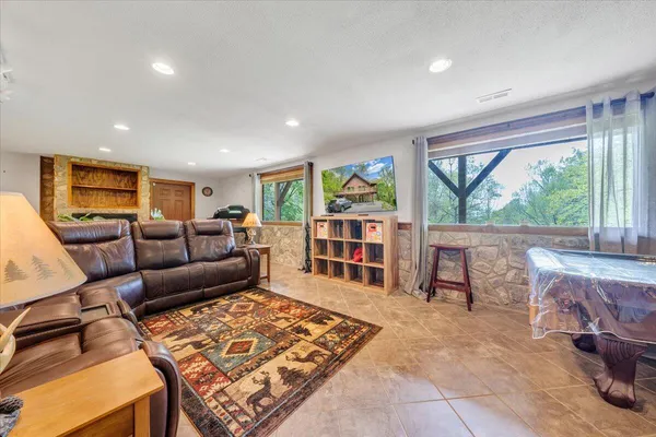 a view of livingroom with an empty space and a fireplace