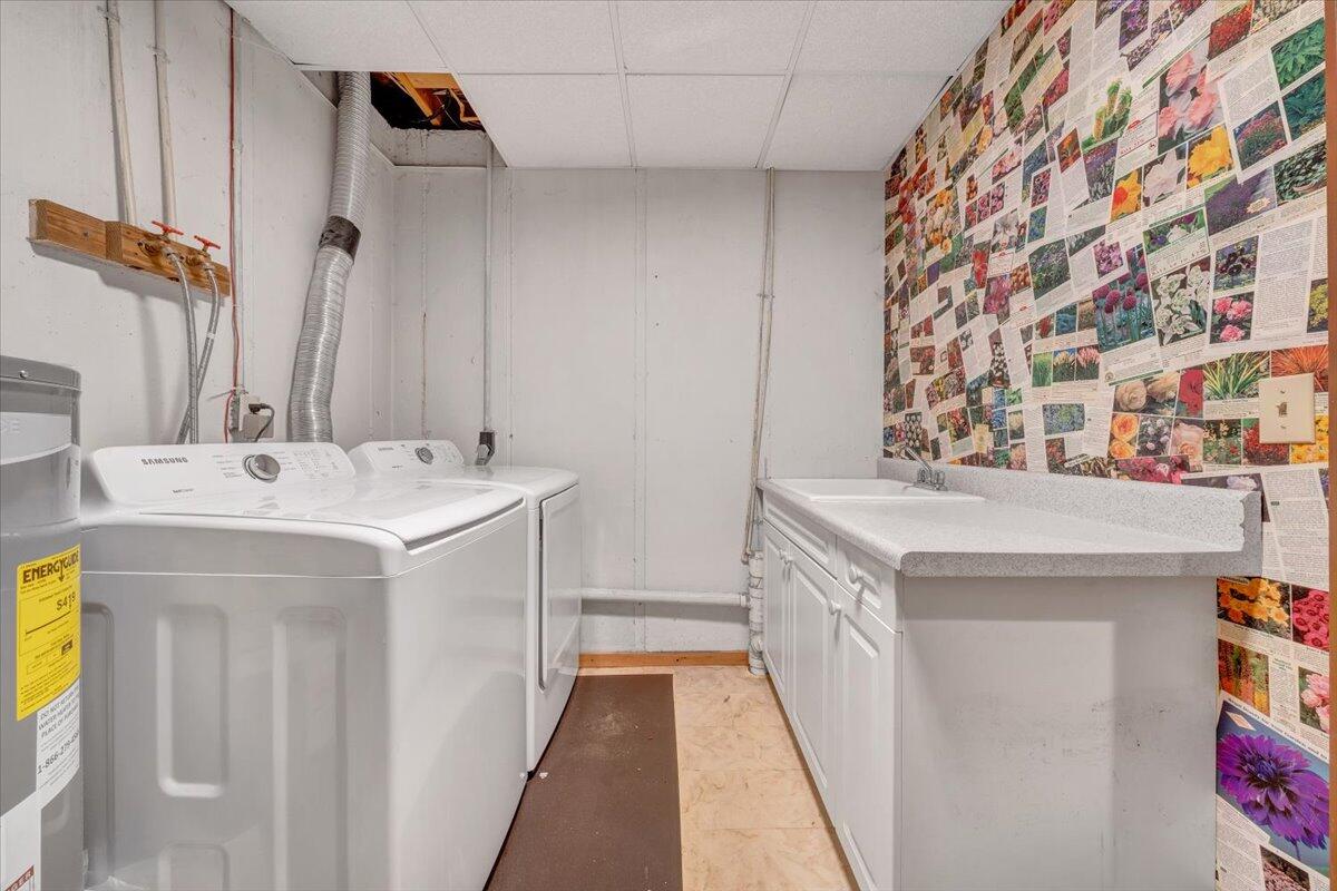13357 Callaway Road Callaway, VA 24067 - Photo 40 of 62 a bathroom with a double vanity sink and a mirror