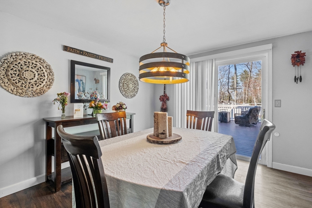 40 Gaita Drive Derry, NH 03038 - Photo 15 of 34 a view of a dining room with furniture window and wooden floor
