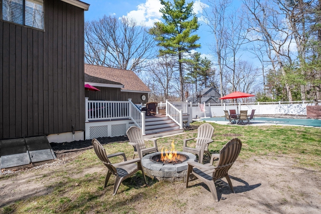40 Gaita Drive Derry, NH 03038 - Photo 19 of 34 a view of a backyard with furniture and a garden