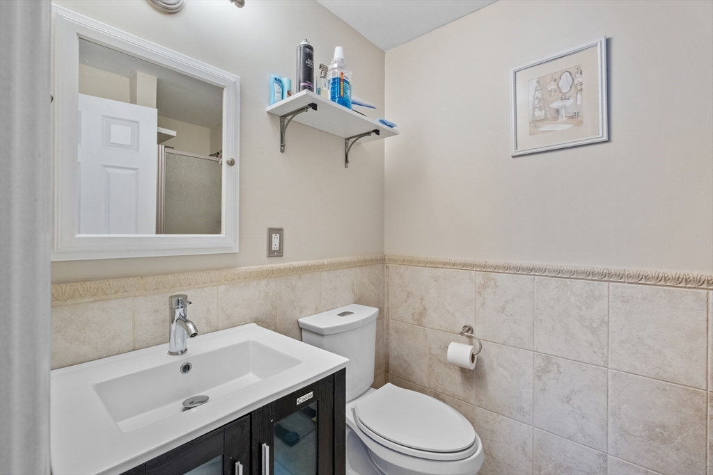 40 Gaita Drive Derry, NH 03038 - Photo 22 of 34 a bathroom with a sink mirror and toilet