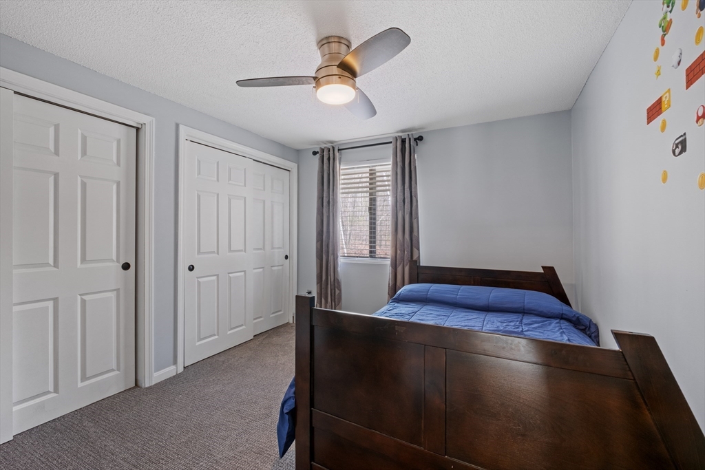 40 Gaita Drive Derry, NH 03038 - Photo 24 of 34 a view of an empty room with window and ceiling fan