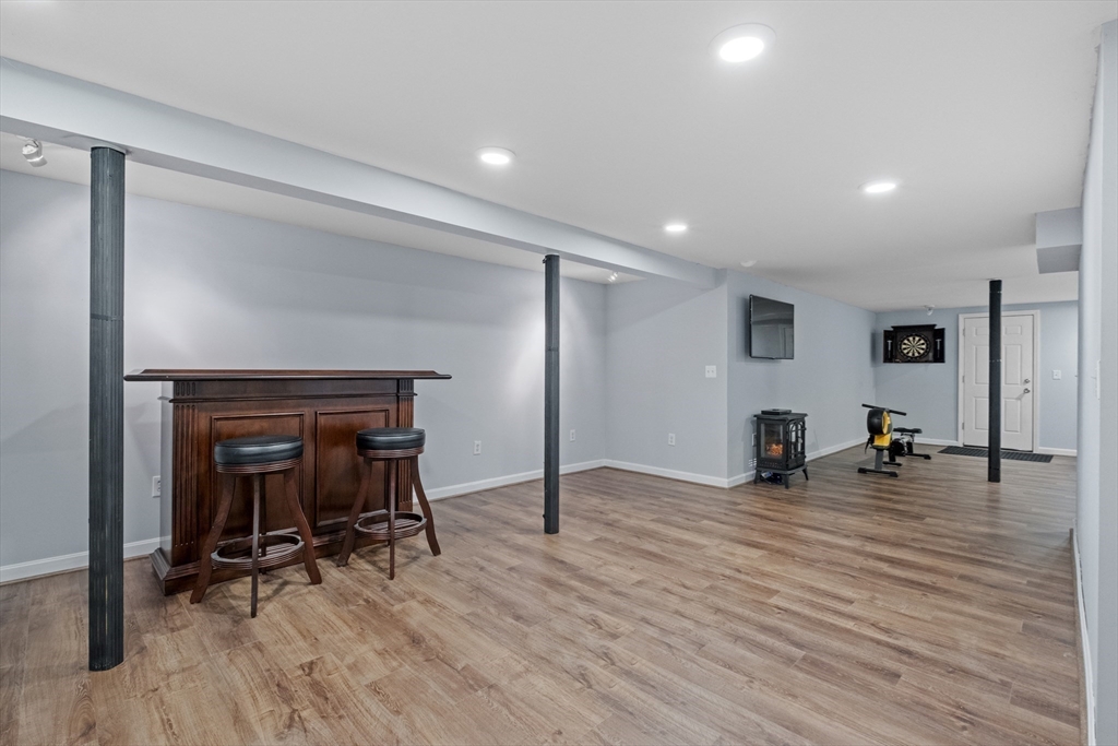 40 Gaita Drive Derry, NH 03038 - Photo 29 of 34 a view of a room with gym equipment and a table