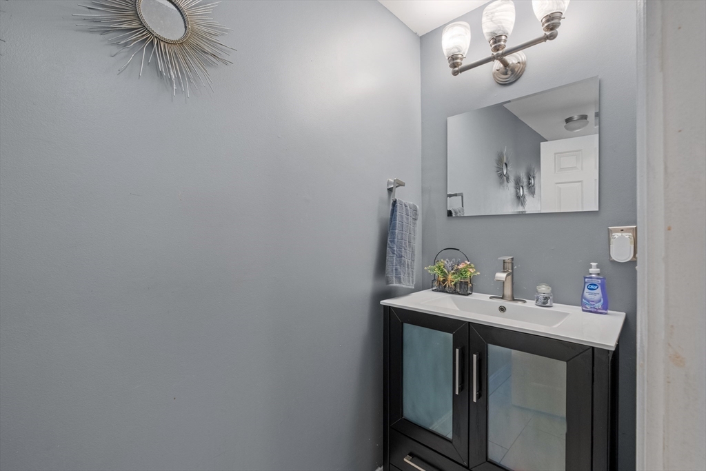 40 Gaita Drive Derry, NH 03038 - Photo 30 of 34 a bathroom with a sink and a mirror