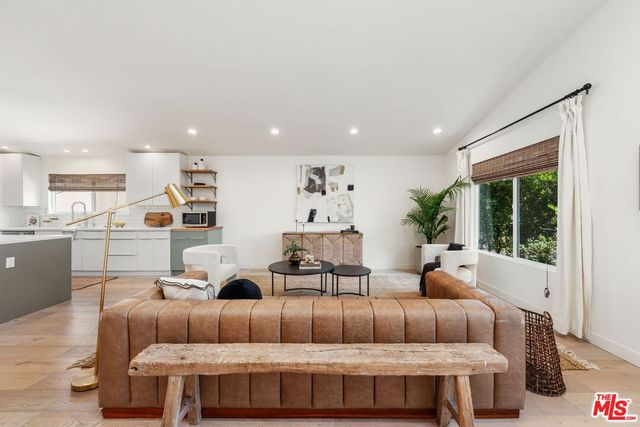 a bedroom with furniture and wooden floor