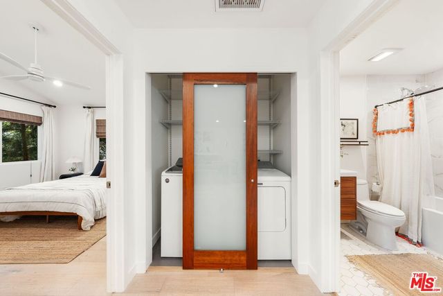 a en suite bathroom with a toilet sink and shower