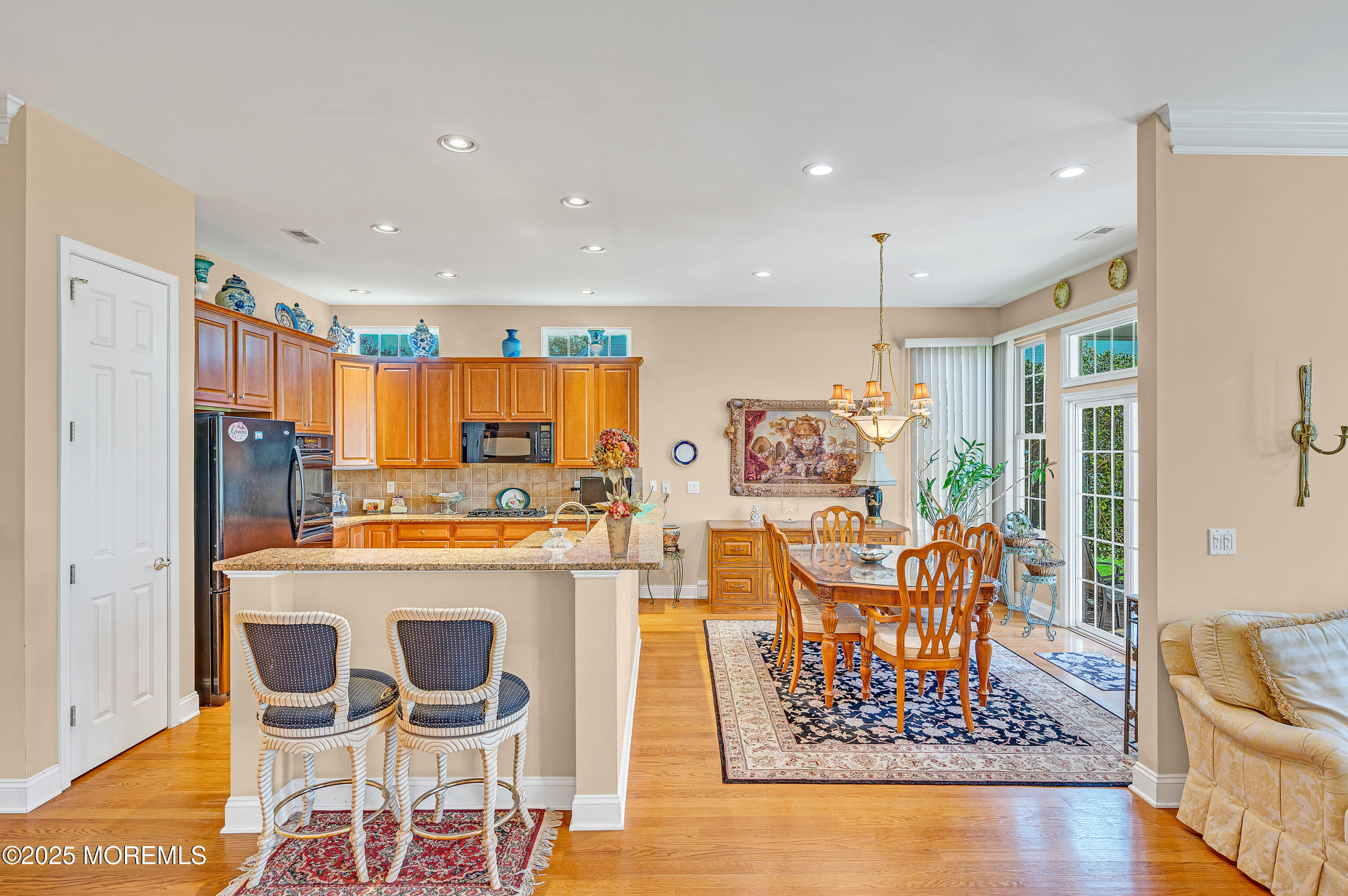 2 Carleton Drive Freehold, NJ 07728 - Photo 13 of 40 a kitchen with stainless steel appliances kitchen island granite countertop a refrigerator and a stove
