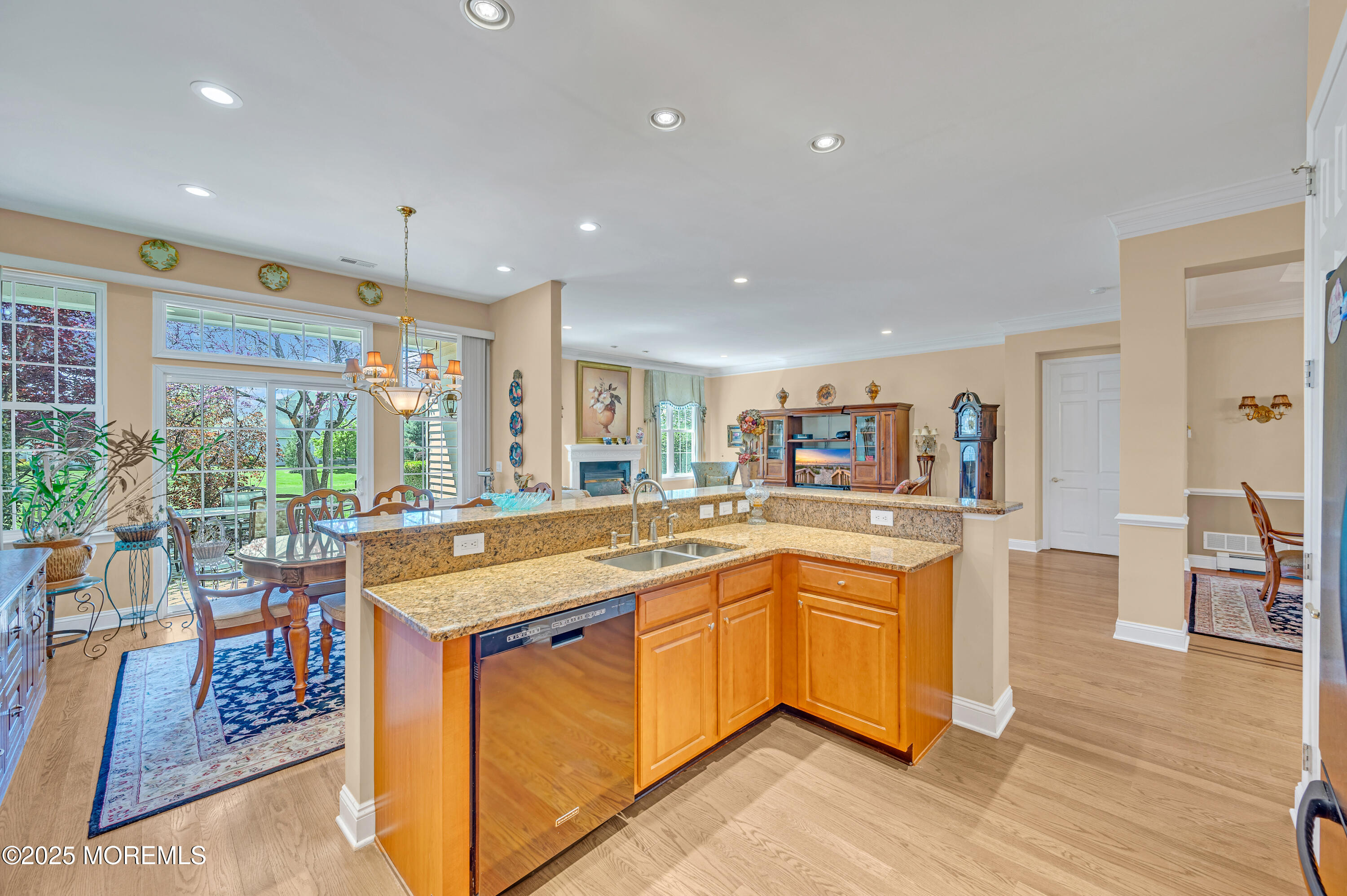 2 Carleton Drive Freehold, NJ 07728 - Photo 15 of 40 a kitchen with stainless steel appliances granite countertop sink stove and wooden floor