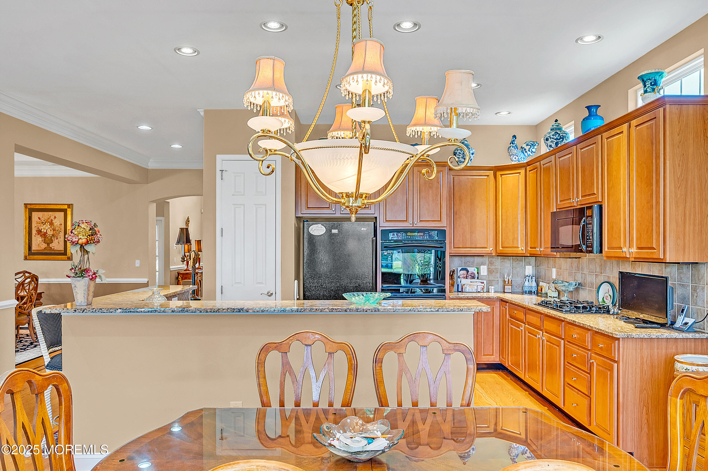 2 Carleton Drive Freehold, NJ 07728 - Photo 17 of 40 a kitchen with stainless steel appliances kitchen island granite countertop a sink and cabinets