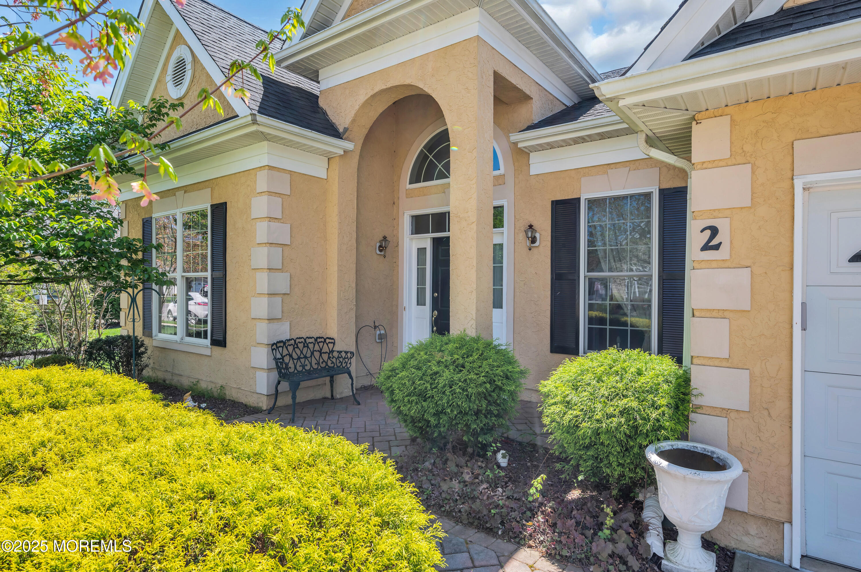 2 Carleton Drive Freehold, NJ 07728 - Photo 3 of 40 a view of a balcony with table and chairs and potted plants