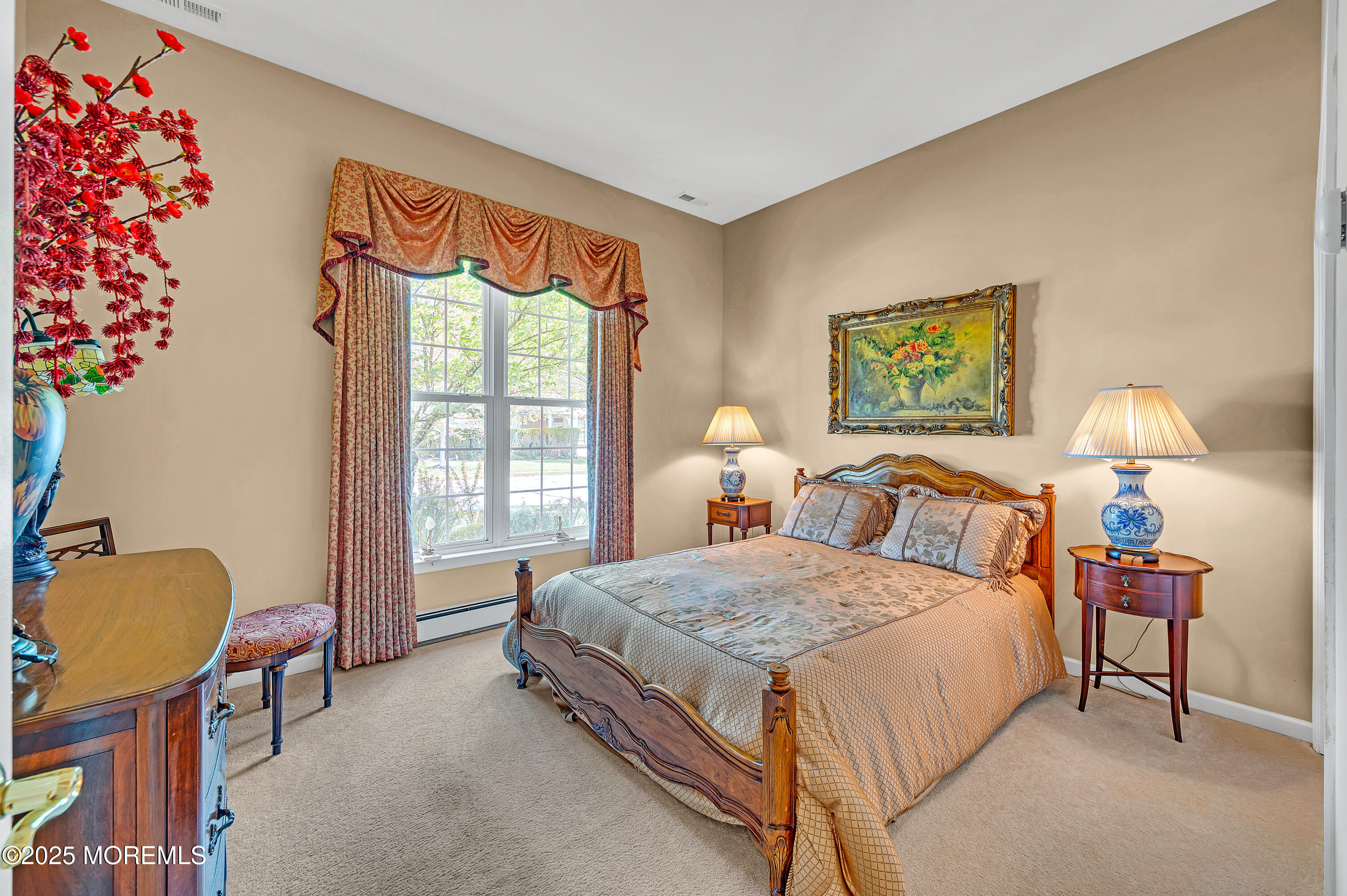 2 Carleton Drive Freehold, NJ 07728 - Photo 32 of 40 a bedroom with a bed and a painting on the wall