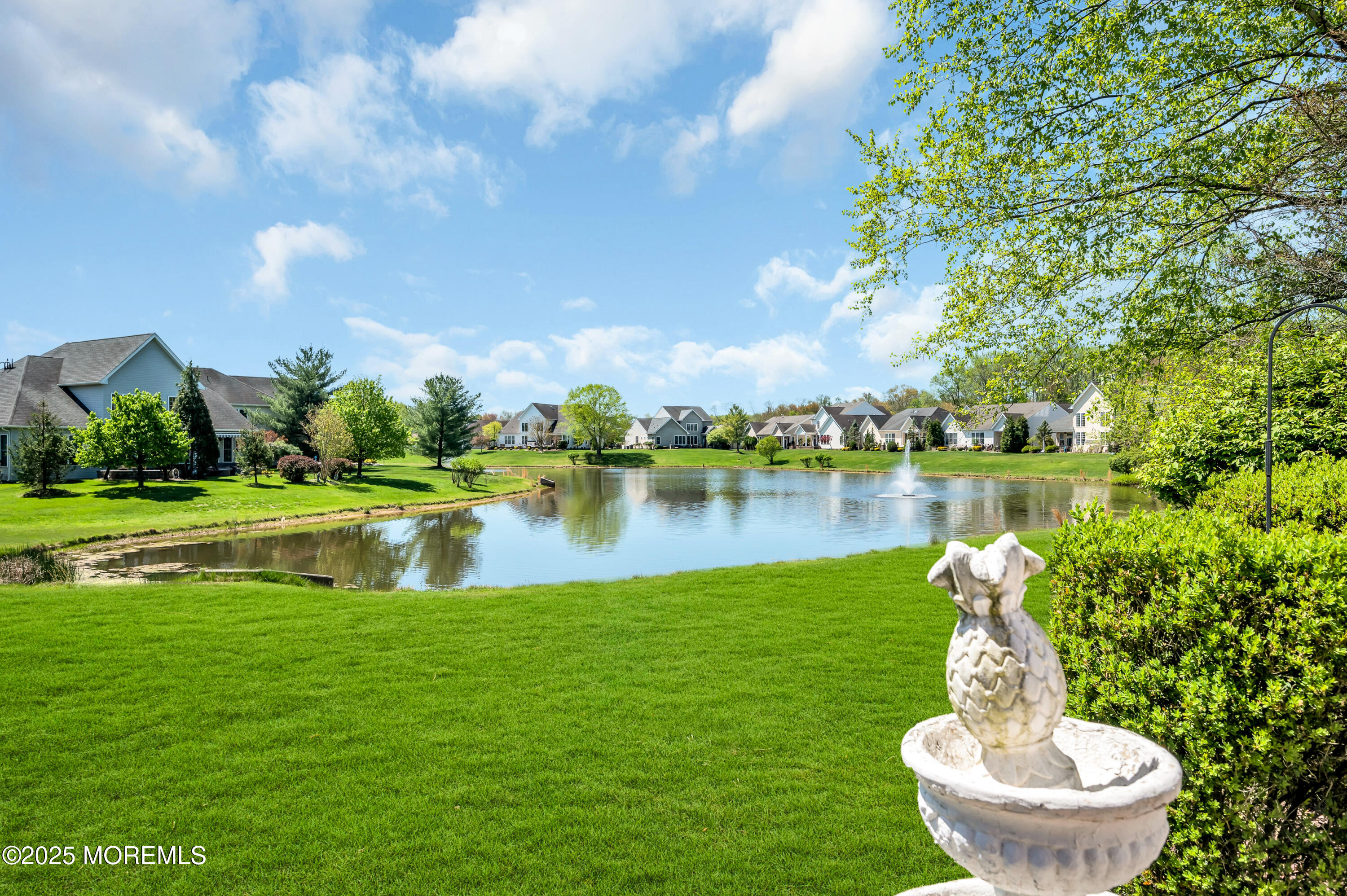 2 Carleton Drive Freehold, NJ 07728 - Photo 34 of 40 a view of a lake with a house in the background