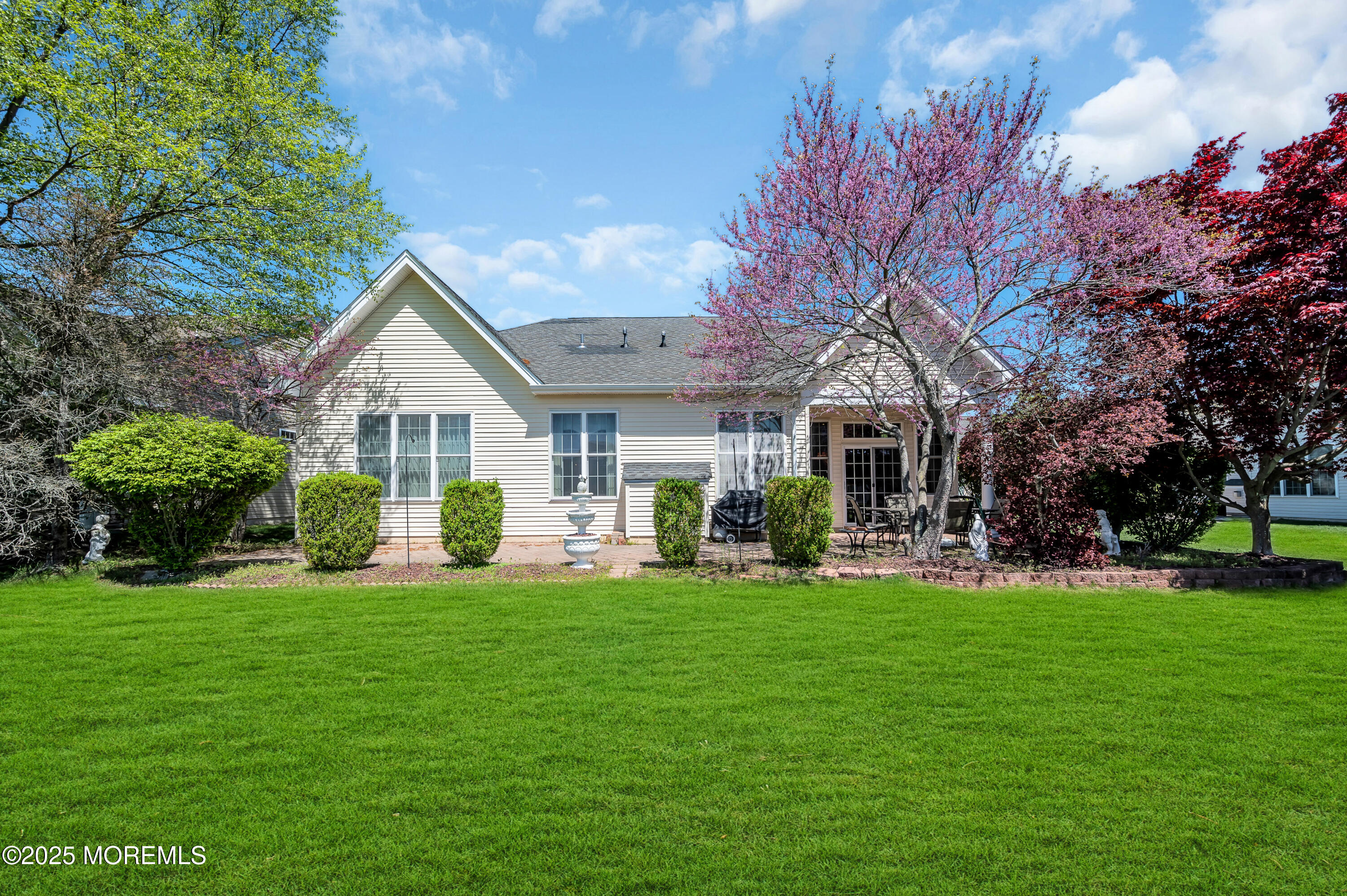 2 Carleton Drive Freehold, NJ 07728 - Photo 37 of 40 a front view of a house with a garden and trees