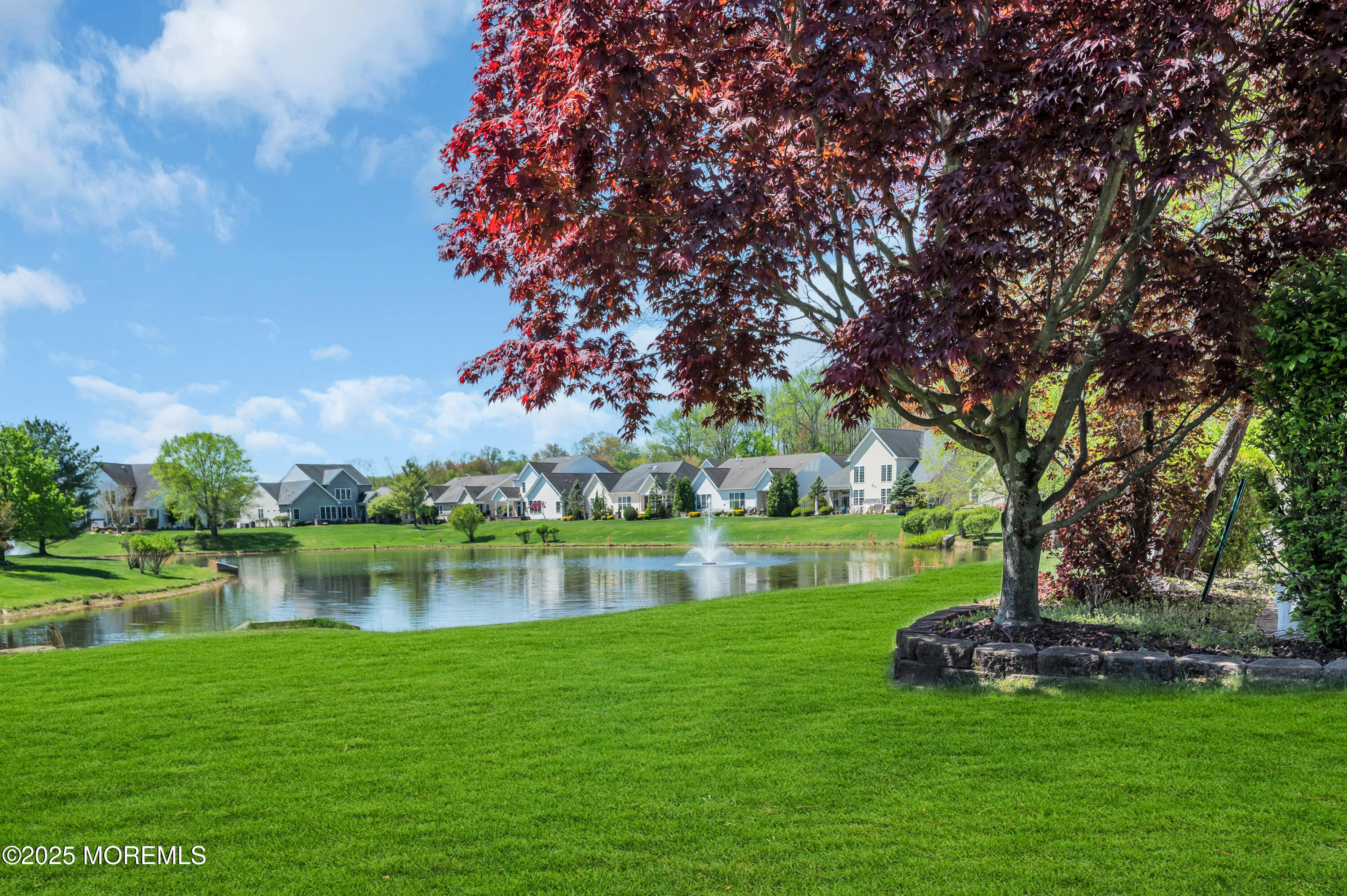 2 Carleton Drive Freehold, NJ 07728 - Photo 39 of 40 a view of a lake with a garden and trees
