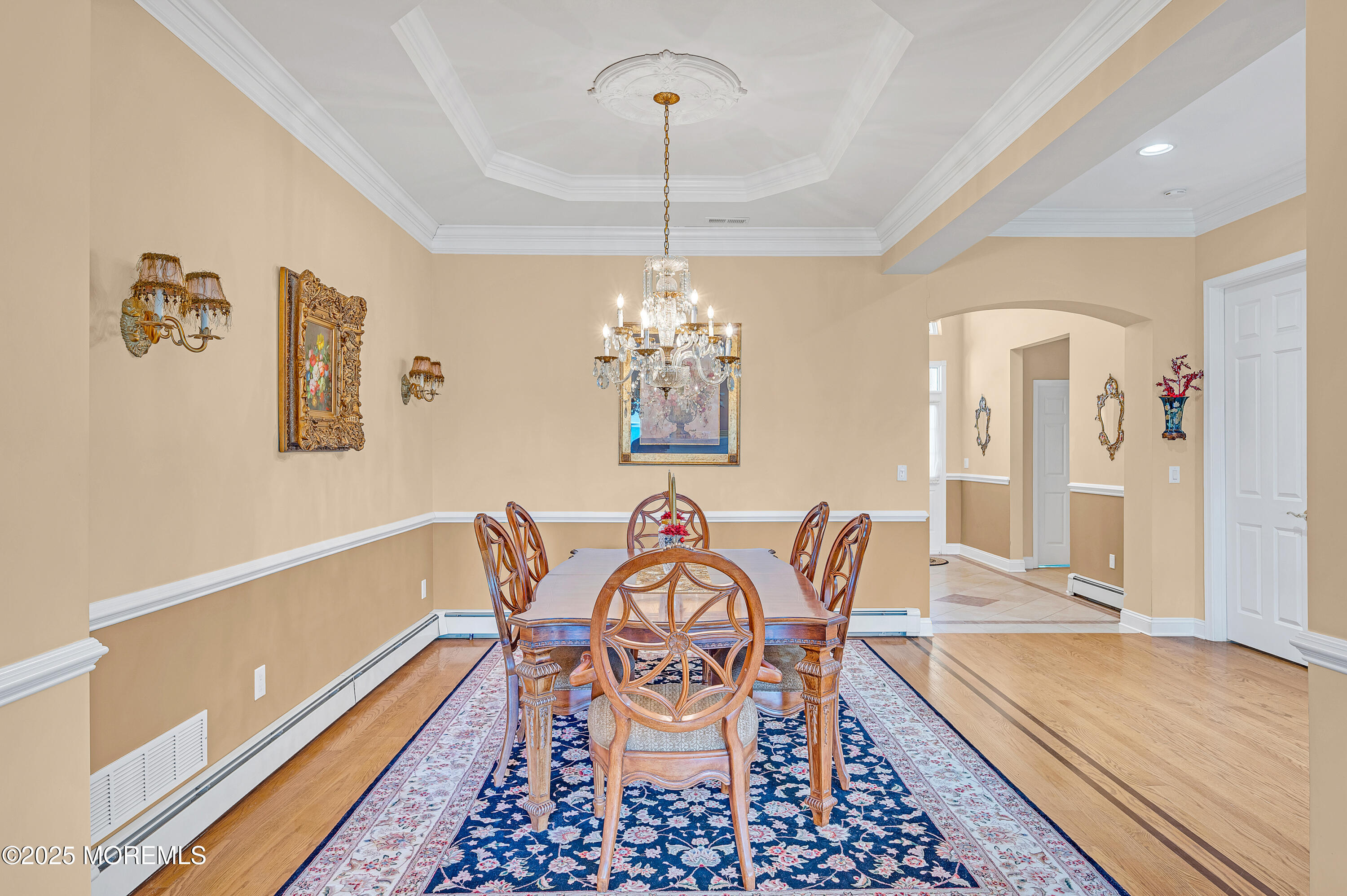 2 Carleton Drive Freehold, NJ 07728 - Photo 7 of 40 a view of a dining room with furniture wooden floor and a chandelier