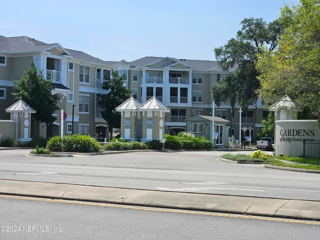 a view of multiple houses with a street