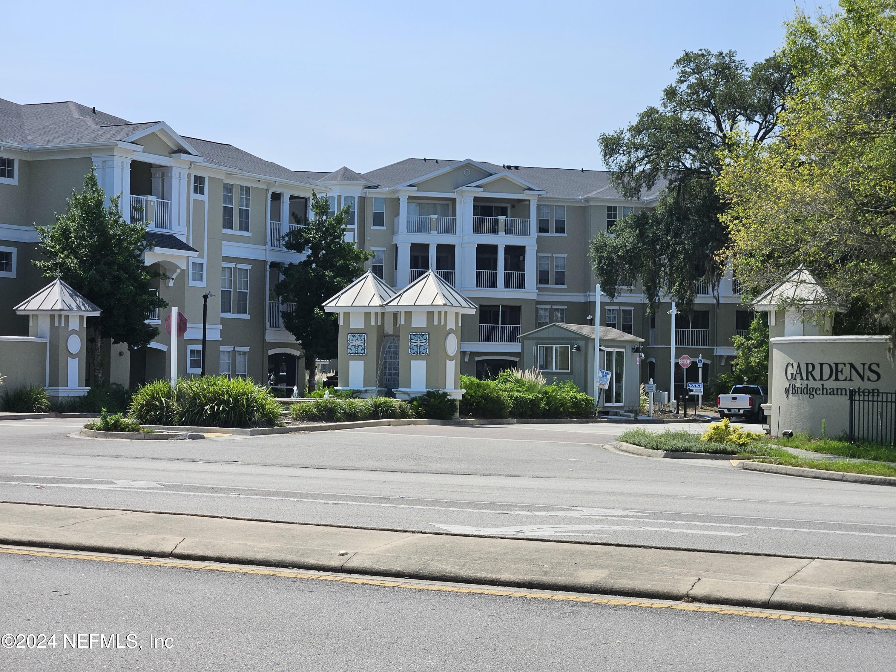 a view of multiple houses with a street