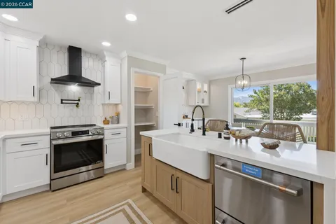 a kitchen with a sink stove and refrigerator