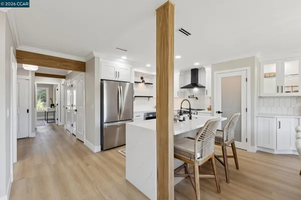 a view of a kitchen from a dining room