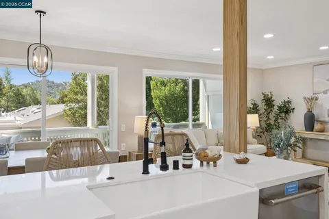 a view of a dining room with furniture window and outside view