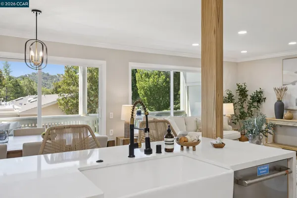 a view of a dining room with furniture window and outside view