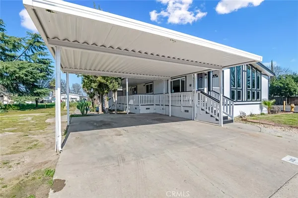 a front view of a house with a patio
