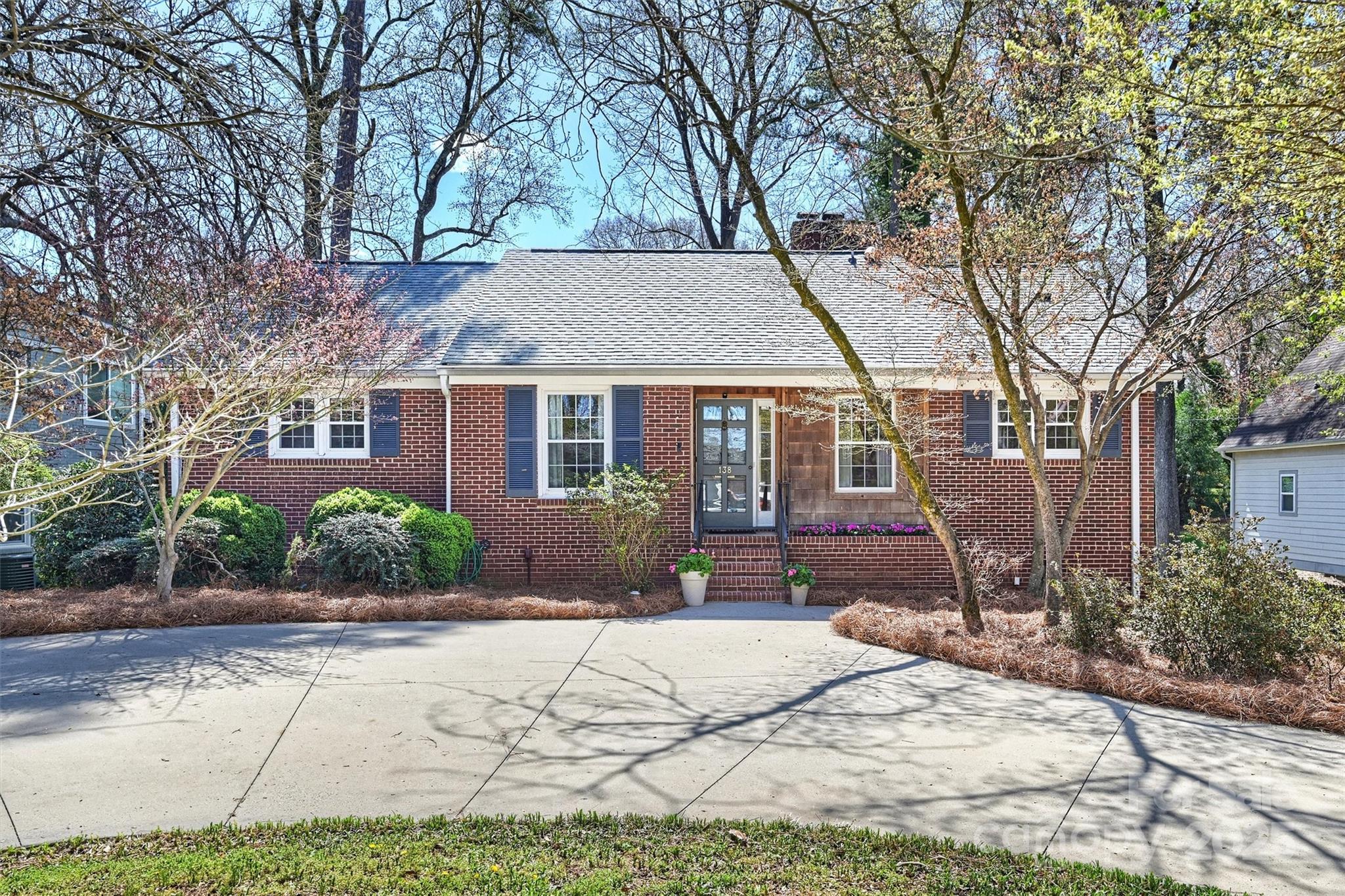 138 Scofield Road Charlotte, NC 28209 - Photo 1 of 36 a front view of a house with a yard