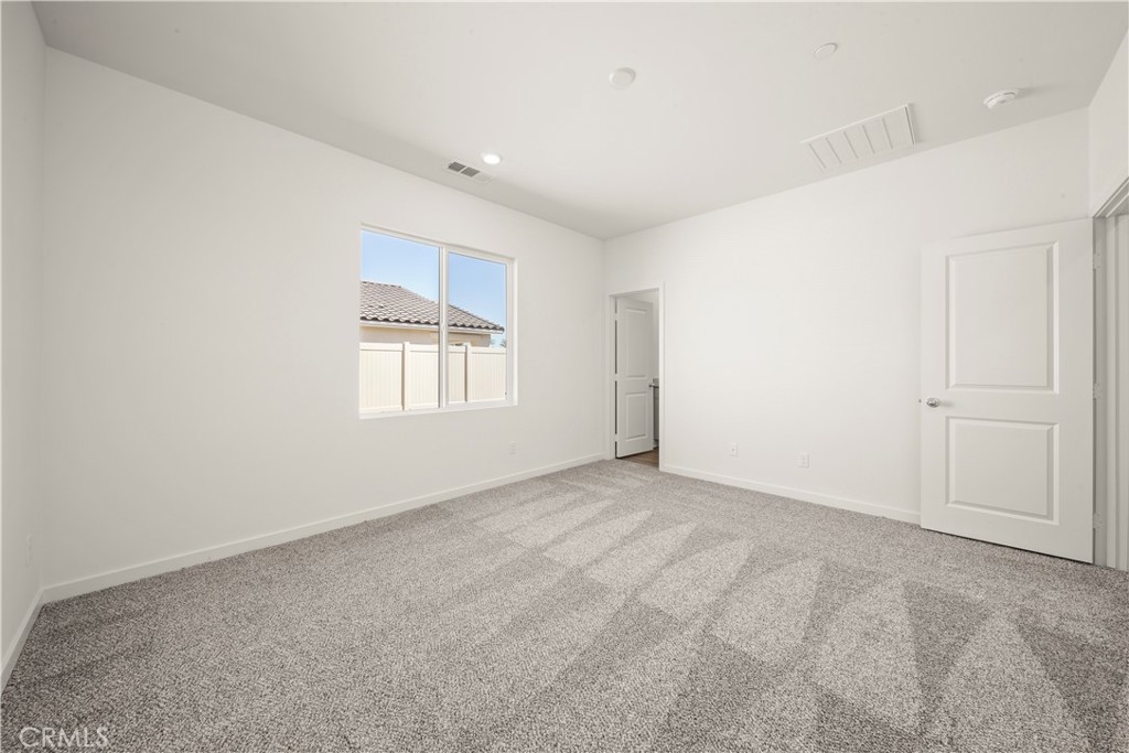 42484 Isla Court Indio, CA 92201 - Photo 14 of 16 an empty room with windows