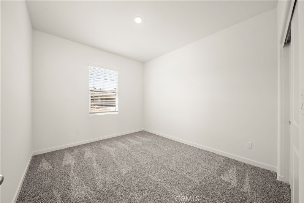42484 Isla Court Indio, CA 92201 - Photo 15 of 16 an empty room with a window