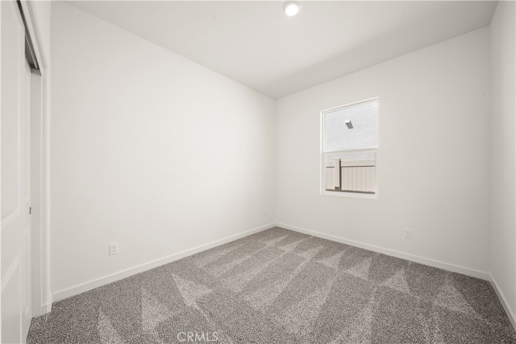 42484 Isla Court Indio, CA 92201 - Photo 16 of 16 an empty room with a empty space and window