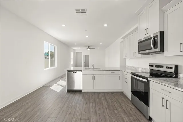 a view of kitchen with sink and window