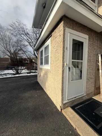 a view of a house with a street