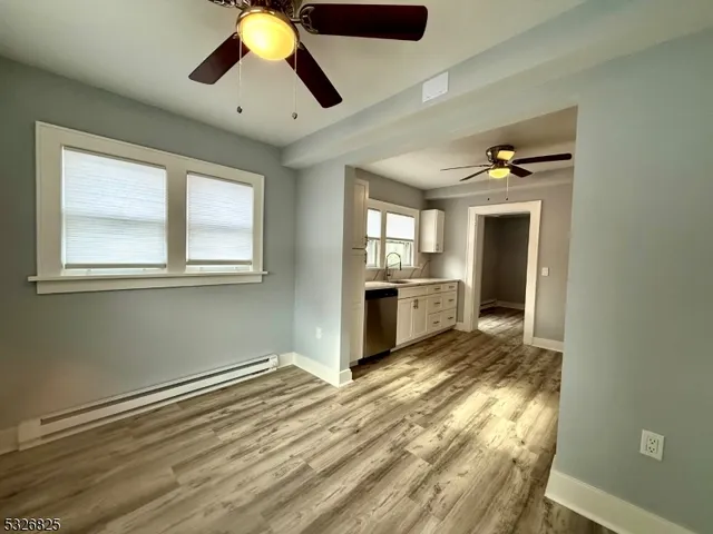 a view of a livingroom with wooden floor