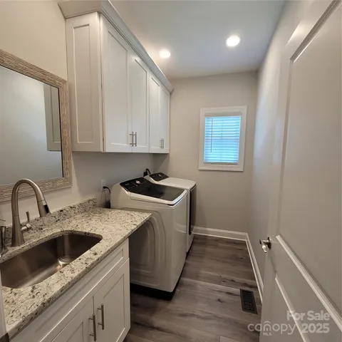 a kitchen that has a sink and a stove in it